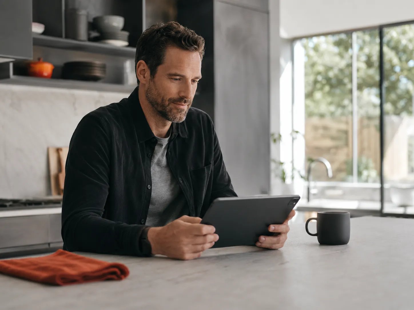 Man reviewing testosterone and estradiol lab results at home, key to preventing gynecomastia on TRT