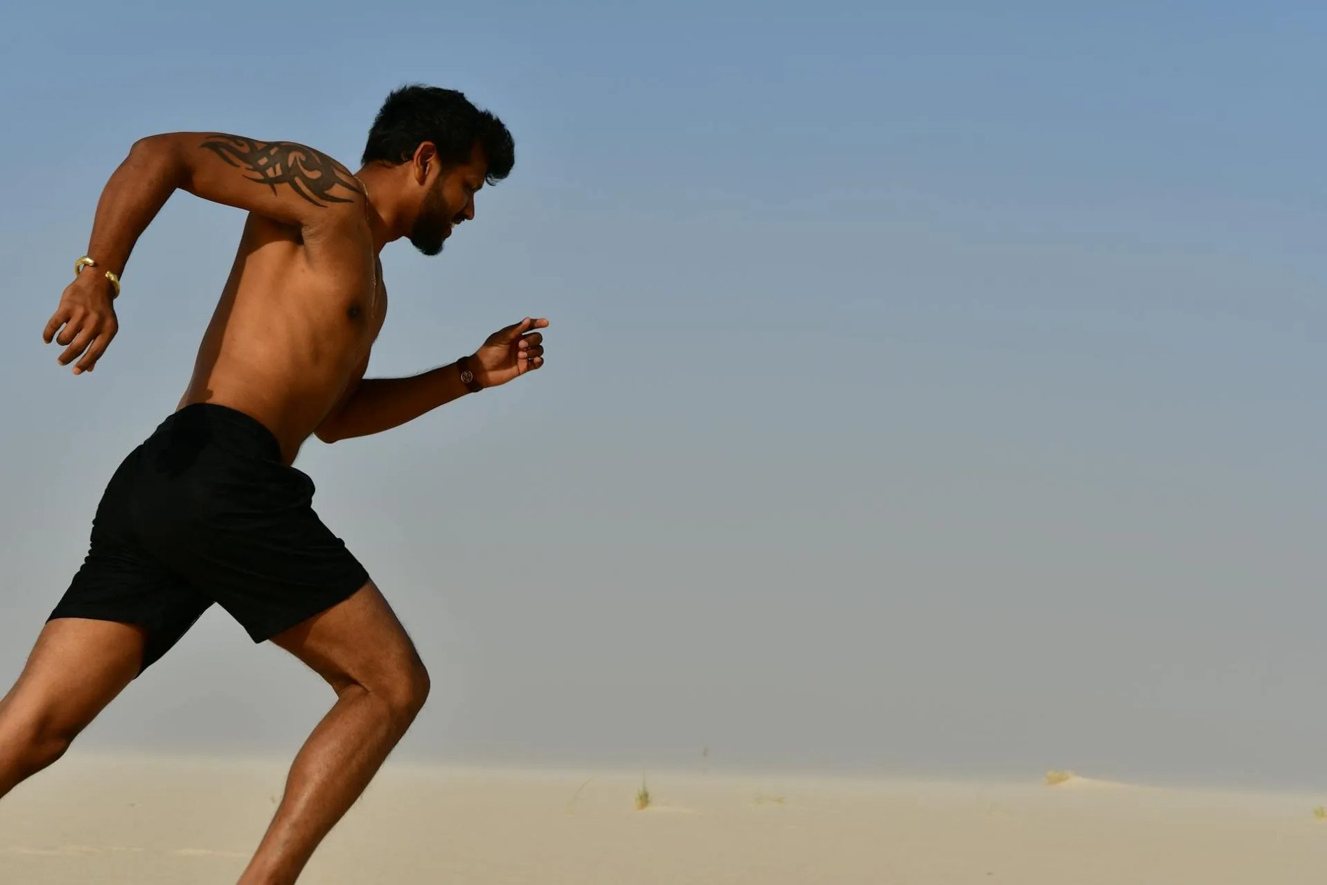 Man on a running start breaking weight loss plateau