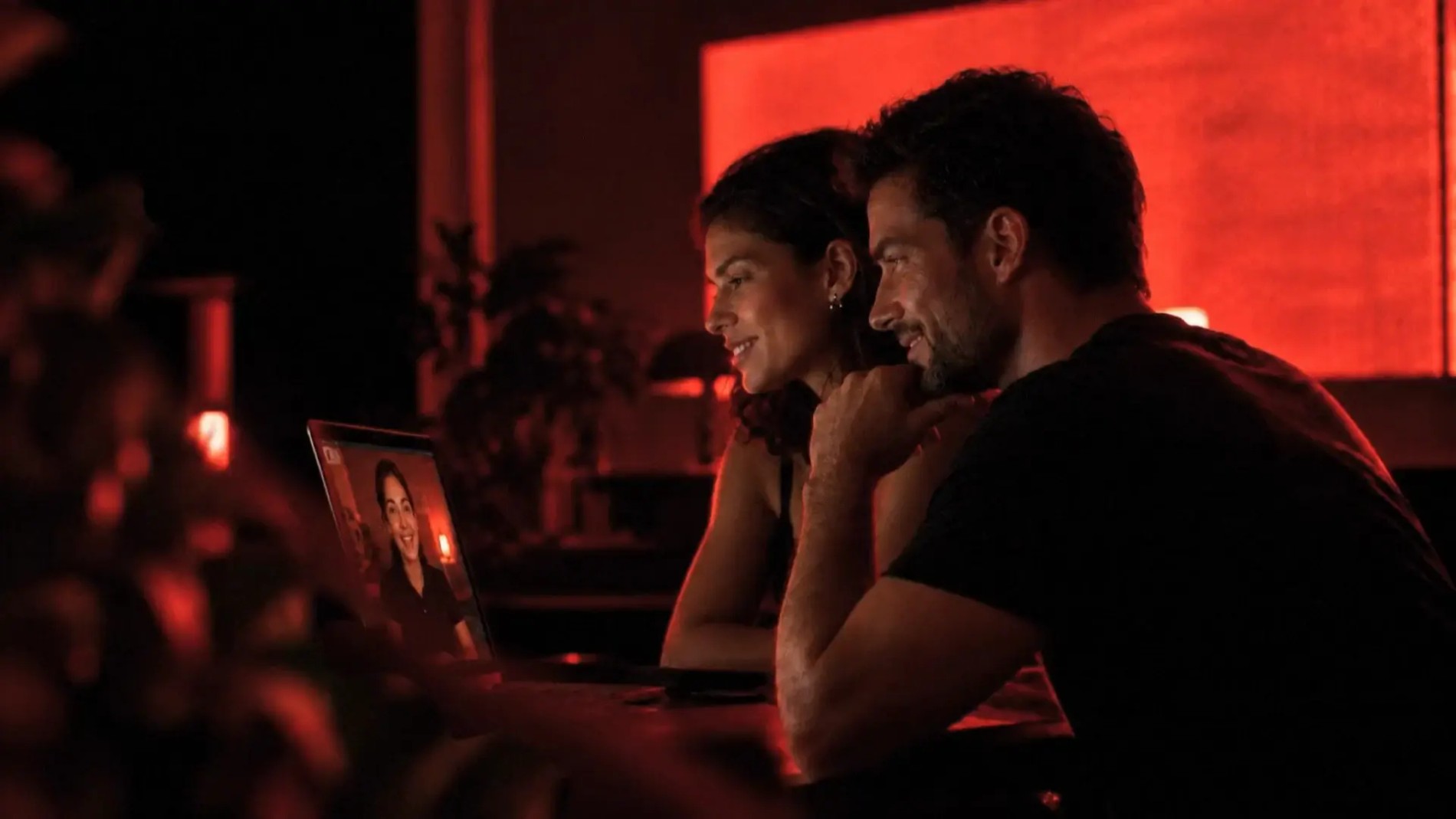A couple reviewing their Marek Health lab results with a coach on a video call